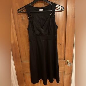 Light weight satin dress with buckle detailing on the straps.